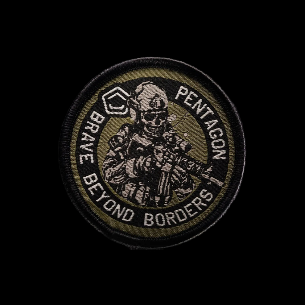 A circular embroidered tactical patch featuring a soldier illustration and the text 'PENTAGON' and 'BRAVE BEYOND BORDERS' on a black background, with a mirrored reflection below.