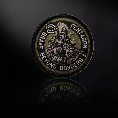 Circular patch with a soldier illustration and text on a dark background