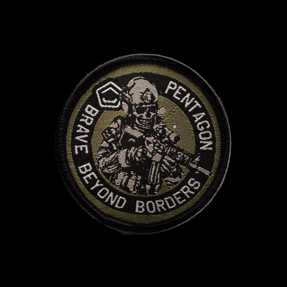 A circular embroidered tactical patch featuring a soldier illustration and the text 'PENTAGON' and 'BRAVE BEYOND BORDERS' on a black background, with a mirrored reflection below.
