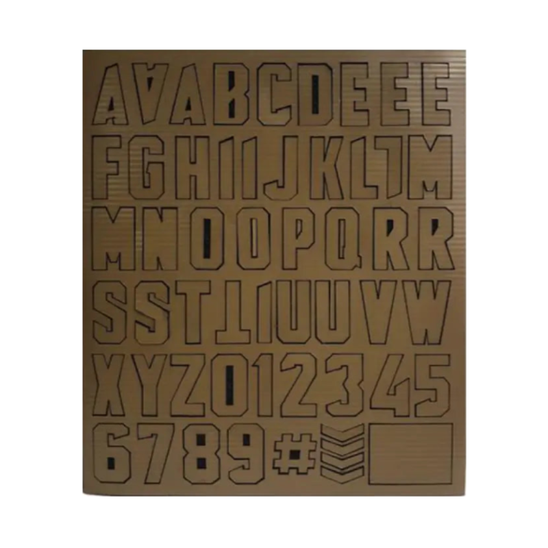 Sheet of laser-cut letters and numbers on a white background
