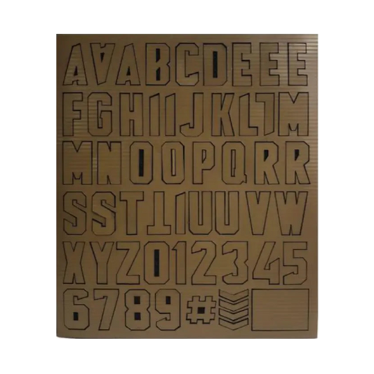 Sheet of laser-cut letters and numbers on a white background