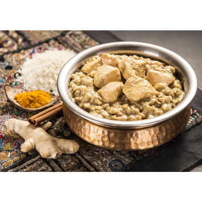 Bowl of food with rice and chicken on a textured surface