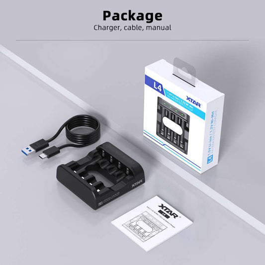 XTAR charger, cable, and manual packaging on a gray surface