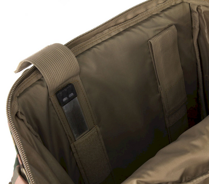 Close-up of a brown backpack with a shoulder strap and pocket.