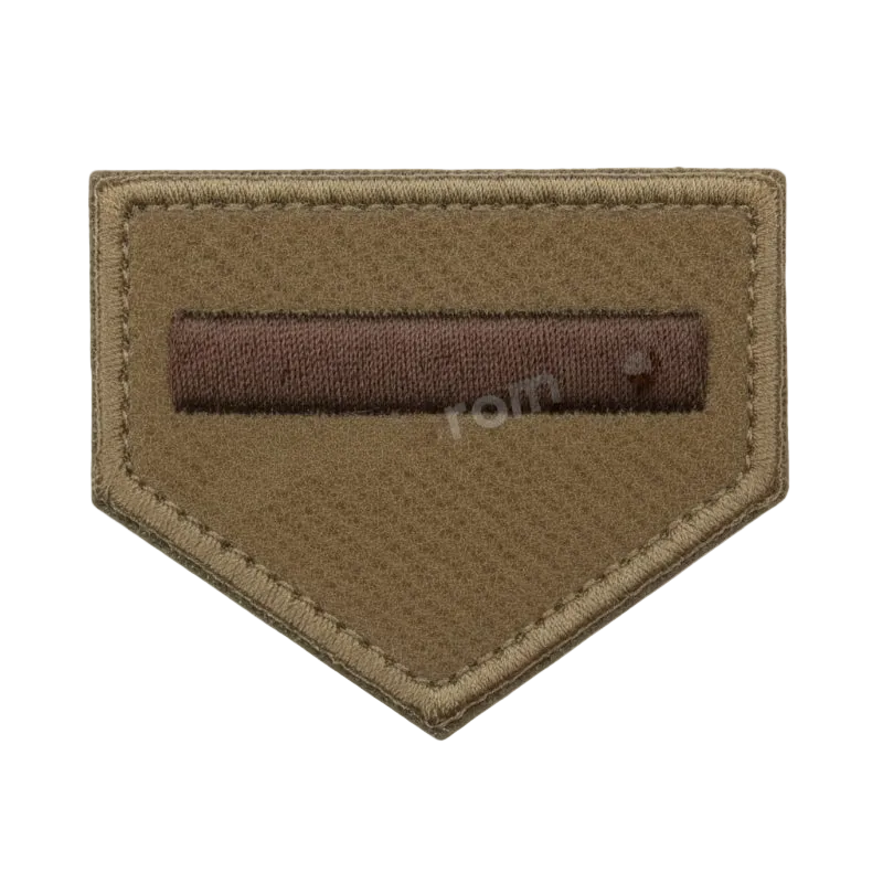 Brown patch with a rectangular brown bar on a white background