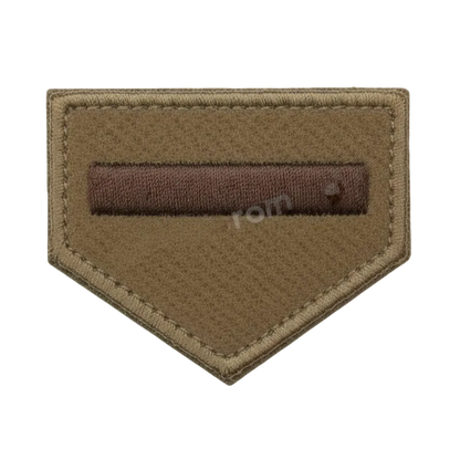 Brown patch with a rectangular brown bar on a white background