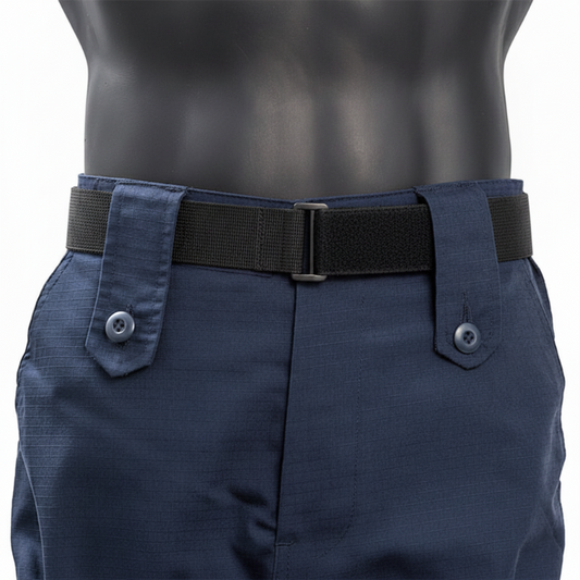 A close-up of navy blue tactical pants on a black mannequin torso, featuring a black web belt with a silver buckle and buttoned flap details on the sides.